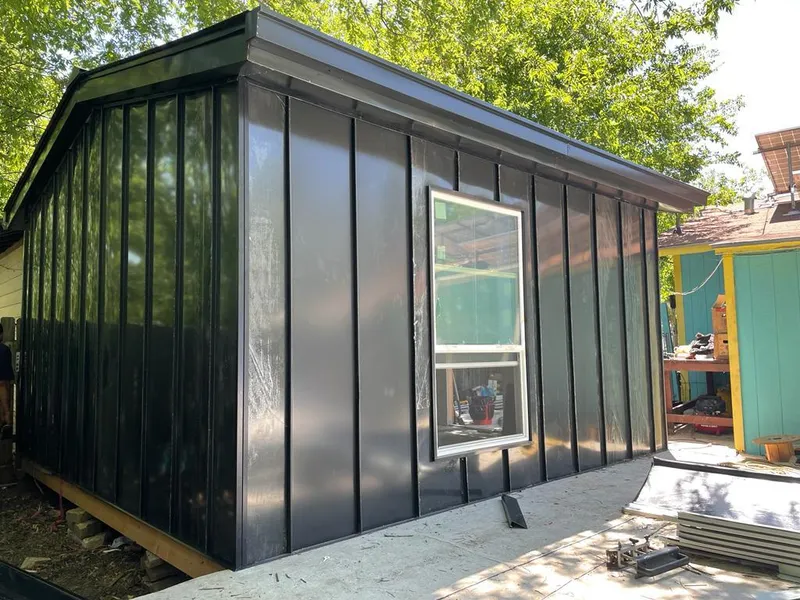 Black standing seam metal wall panels for Roof Inspection in Everett